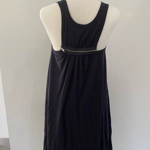 Little black cotton dress. Knee length and the sides are longer.